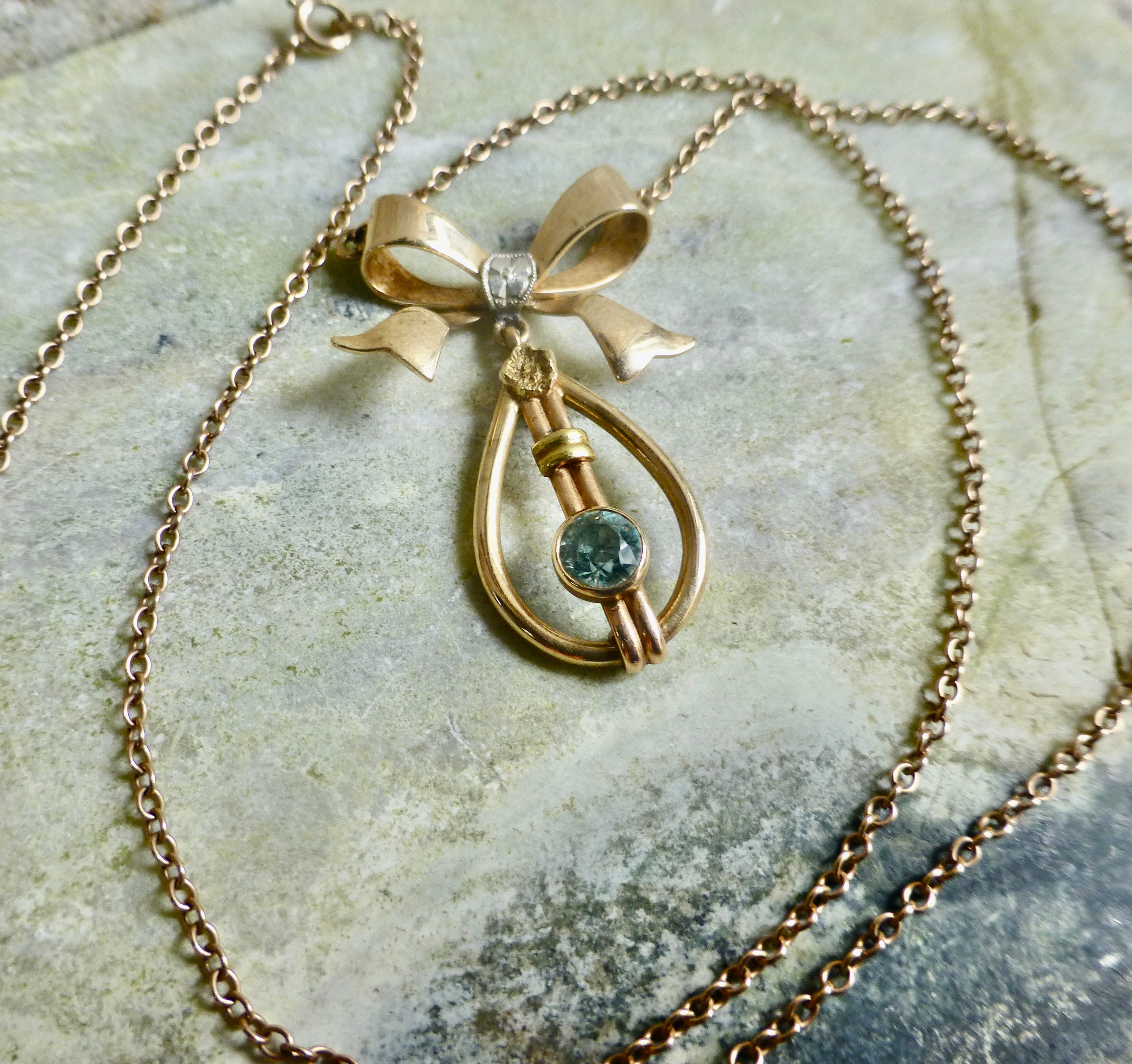 Art Deco Blue Zircon Bow Necklace In 10 Karat Gold